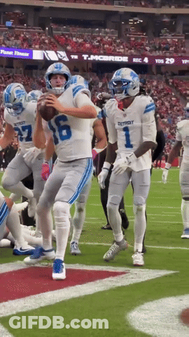 Football Player In Detroit Jersey Throws Ball GIF