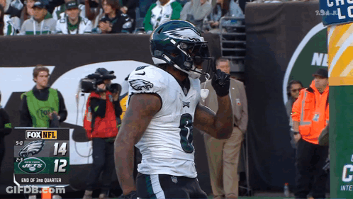 Football Player In Front Of Fox NFL Scoreboard GIF