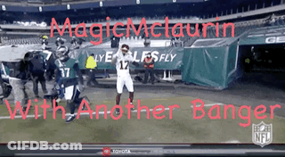 Football Player In Front Of Magic Mclaurin Banner GIF