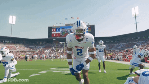 Football Player In Front Of Wing Stop Scoreboard GIF