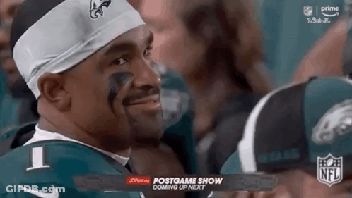 Football Player In Green Jersey And Headband Smiling GIF