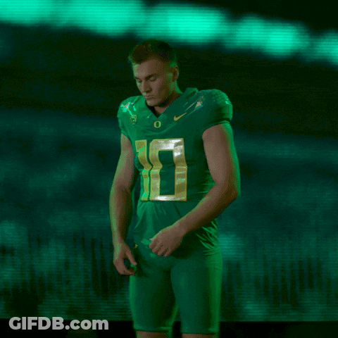 Football Player In Green Jersey Number 10 Arms Crossed GIF