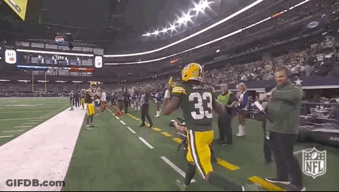 Football Player In Green Jersey Number 33 Running GIF