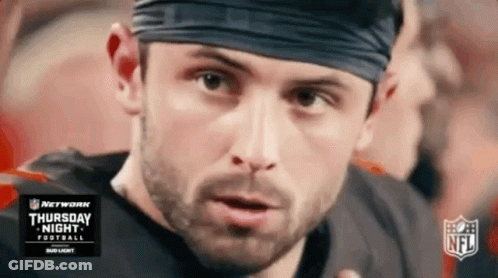 Football Player In Headband Looking At Camera GIF