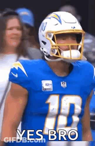 Football Player In Helmet And Blue Jersey In Front Of Crowd GIF