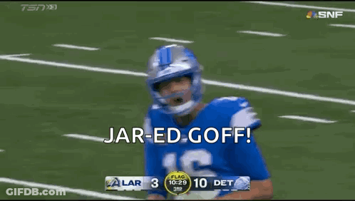 Football Player In Helmet And Blue Jersey Standing On Field GIF