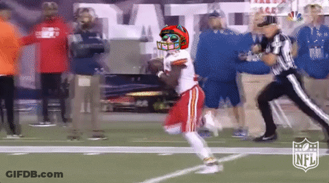 Football Player In Helmet And Sunglasses Running Past Referee GIF