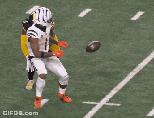 Football Player In Helmet In Front Of Crowd GIF