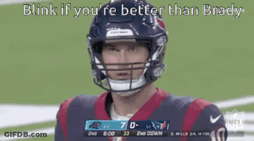 Football Player In Helmet Looking At Camera GIF