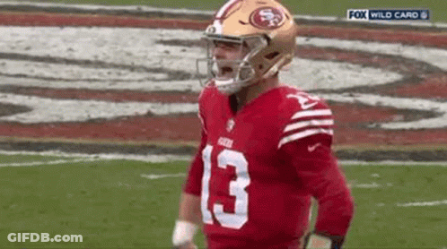 Football Player In Helmet On Field GIF