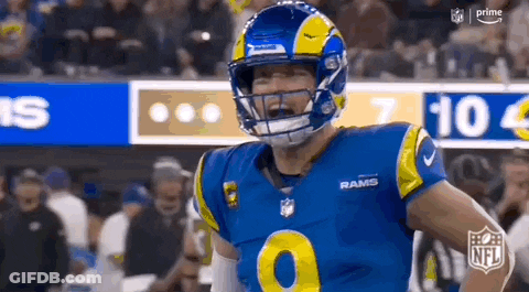 Football Player In Helmet Standing On Field GIF