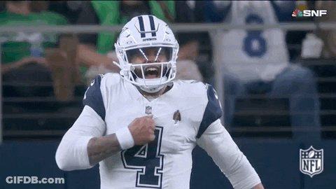 Football Player In Helmet Standing On Field GIF
