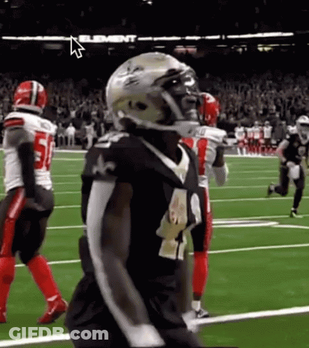 Football Player In Helmet Standing On Field GIF