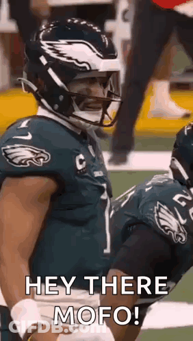Football Player In Helmet Talking To Another GIF