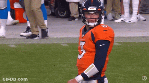 Football Player In Jersey Number 3 Standing On Field GIF