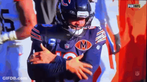 Football Player In Jersey With Letter M GIF