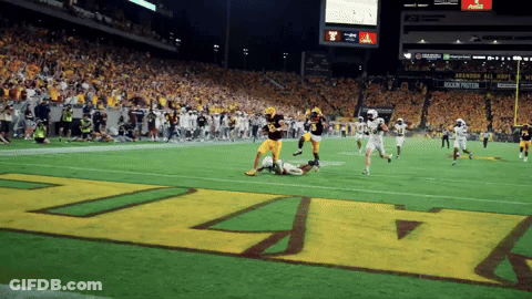 Football Player In Maroon Jersey Number 10 Throwing Ball GIF