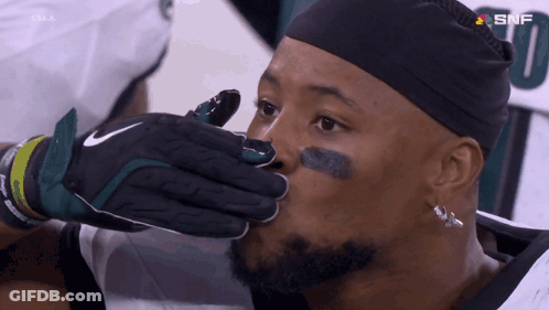 Football Player In Nike Glove Holding Mouth Open GIF