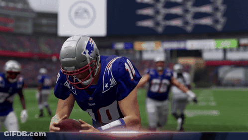 Football Player In Number 10 Jersey Holding Football GIF
