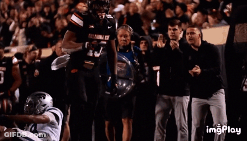 Football Player In Number 10 Jersey In Front Of Crowd GIF