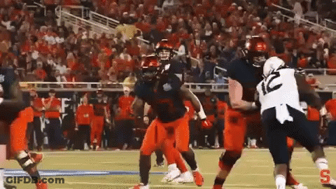 Football Player In Number 10 Jersey Tackled GIF