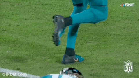 Football Player In Number 16 Jersey Lying On Field GIF