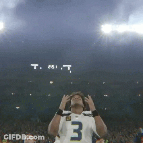 Football Player In Number 3 Jersey In Front Of Scoreboard GIF