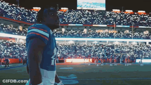 Football Player In Number 4 Jersey On Field GIF