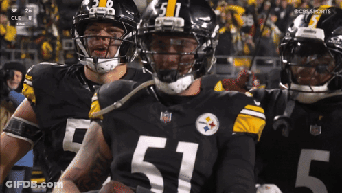 Football Player In Number 51 Jersey Holding Football GIF