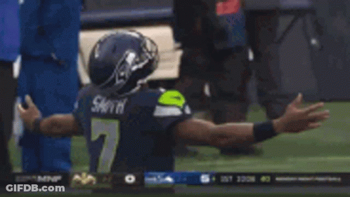 Football Player In Number 7 Jersey Kneeling GIF