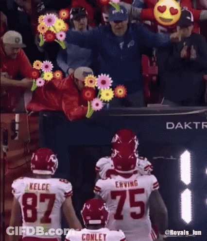 Football Player In Number 75 Jersey Next To Another Player GIF
