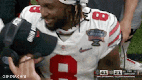 Football Player In Number 9 Jersey Being Interviewed GIF