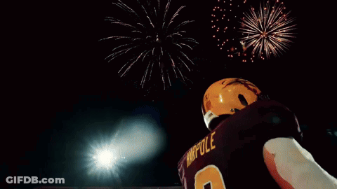 Football Player In Number 9 Jersey With Fireworks GIF