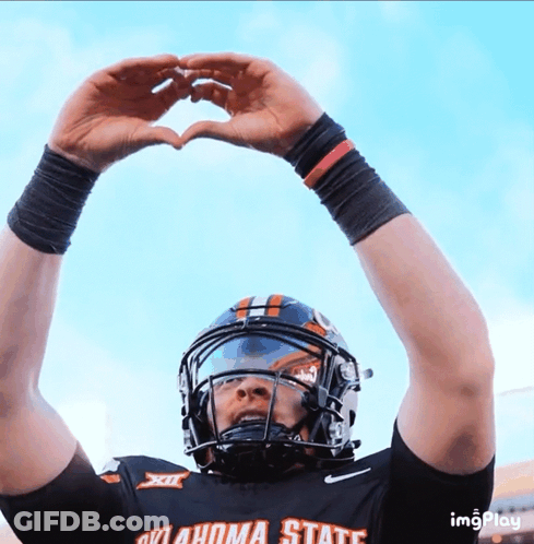 Football Player In Oklahoma State Jersey Making Heart With Hands GIF