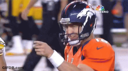 Football Player In Orange Jersey With Horse Helmet GIF