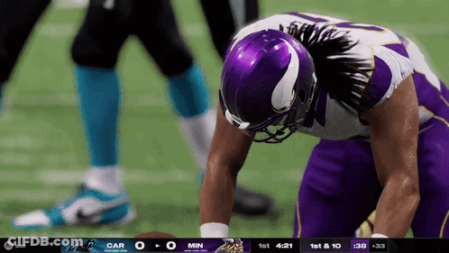 Football Player In Purple Helmet Looking Down GIF