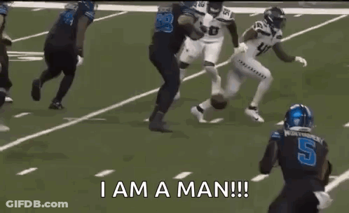 Football Player In Purple Jersey And Red Riddell Helmet GIF