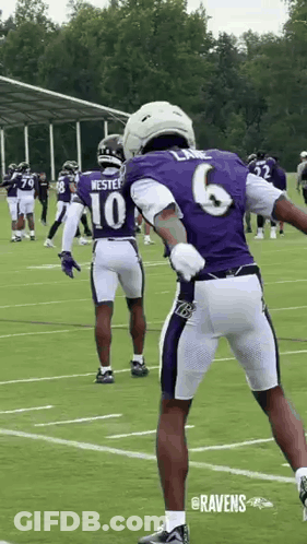 Football Player In Purple Jersey And White Shorts GIF