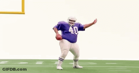 Football Player In Purple Jersey Jumping GIF