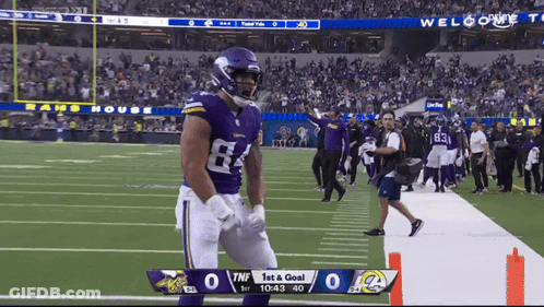 Football Player In Purple Jersey Number 64 GIF