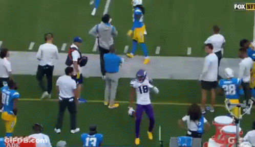Football Player In Purple Uniform Dancing On Field GIF
