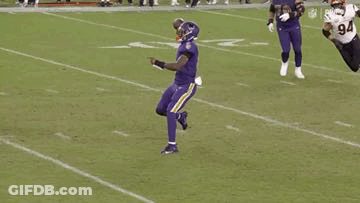 Football Player In Purple Uniform Jumping GIF