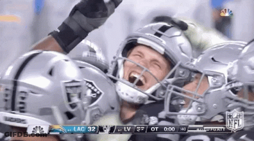 Football Player In Raiders Helmet Celebrating Touchdown GIF