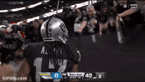 Football Player In Raiders Helmet In Front Of Crowd GIF