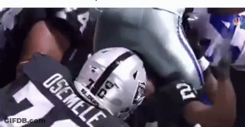 Football Player In Raiders Jersey Being Tackled GIF