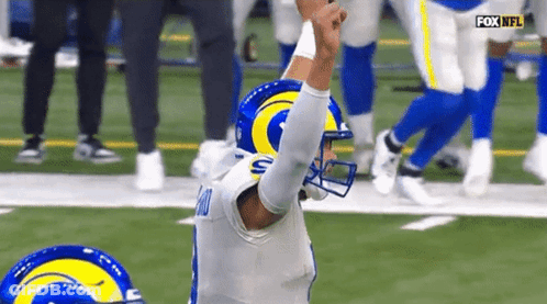 Football Player In Rams Helmet Kneeling On Field GIF
