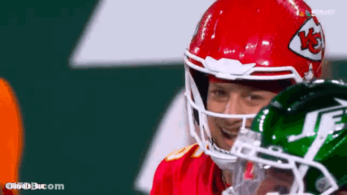 Football Player In Red And Green Helmet With Jets GIF