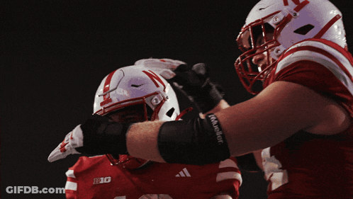 Football Player In Red And White Uniform With Big GIF