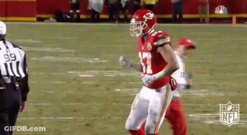 Football Player In Red Helmet And White Pants Running GIF