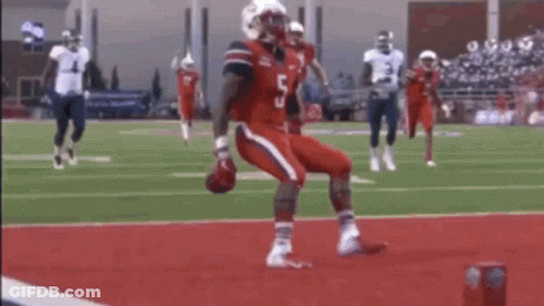 Football Player In Red Jersey Being Tackled By White Jersey GIF